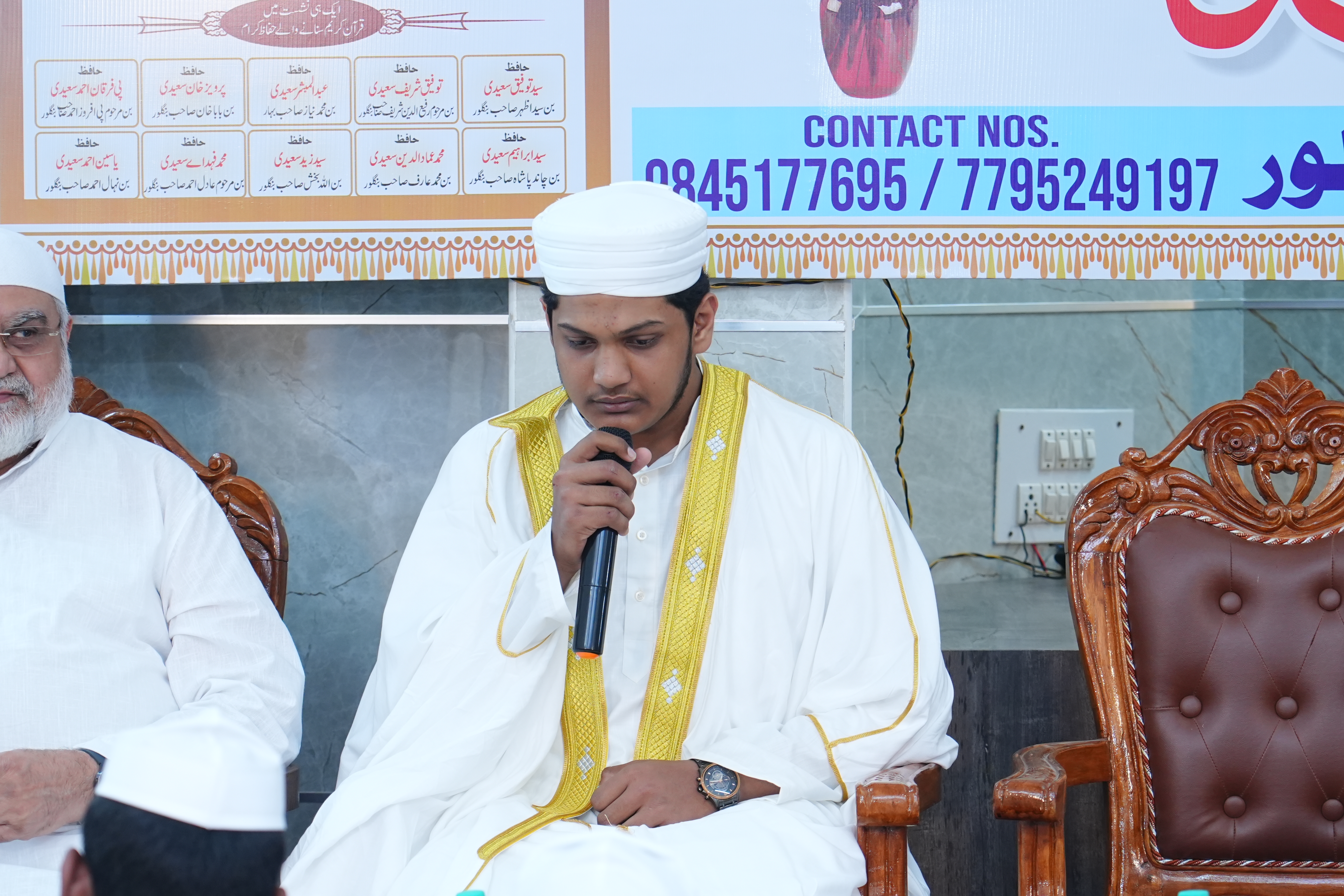 Student holding Holy Quran